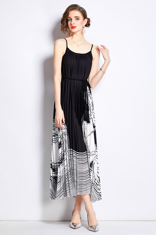 Sleeveless boho maxi dress with pleated skirt, belted waist, stretch fabric, and round neckline for elegant summer style model display product image 5