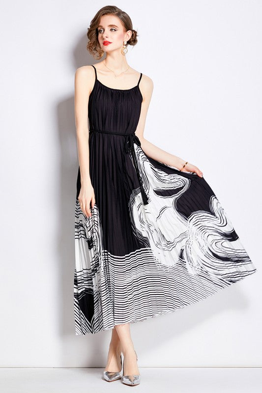 Sleeveless boho maxi dress with pleated skirt, belted waist, stretch fabric, and round neckline for elegant summer style front model  product image
