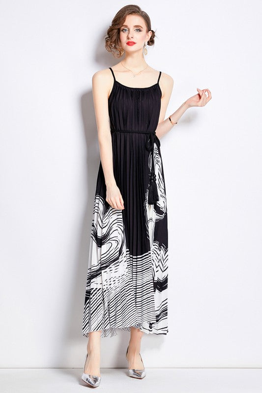 Sleeveless boho maxi dress with pleated skirt, belted waist, stretch fabric, and round neckline for elegant summer style model display product image 6